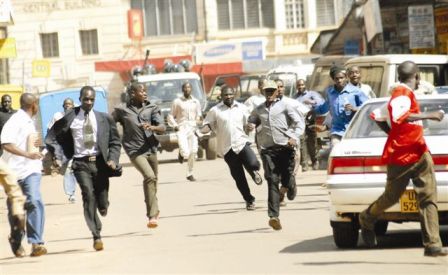 Demonstrators running away from Ugandan police force vehicles. Kampala Nov 07.jpg